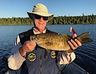 1 of 25 Trophy Smallmouth Bass Fishing at Fireside Lodge in Canada by Paul  